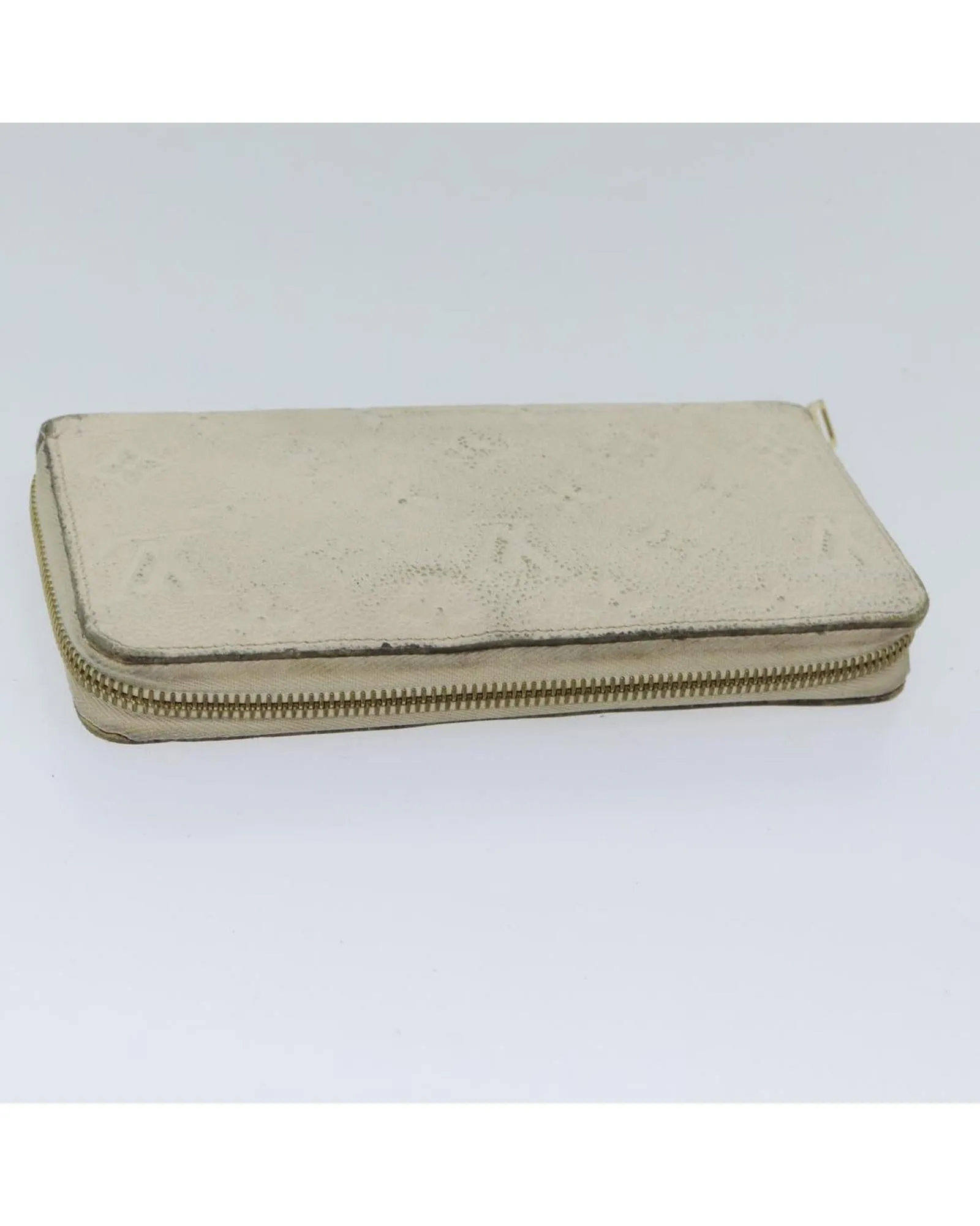 Embossed Leather Zippy Wallet with Multiple Pockets and Compartments