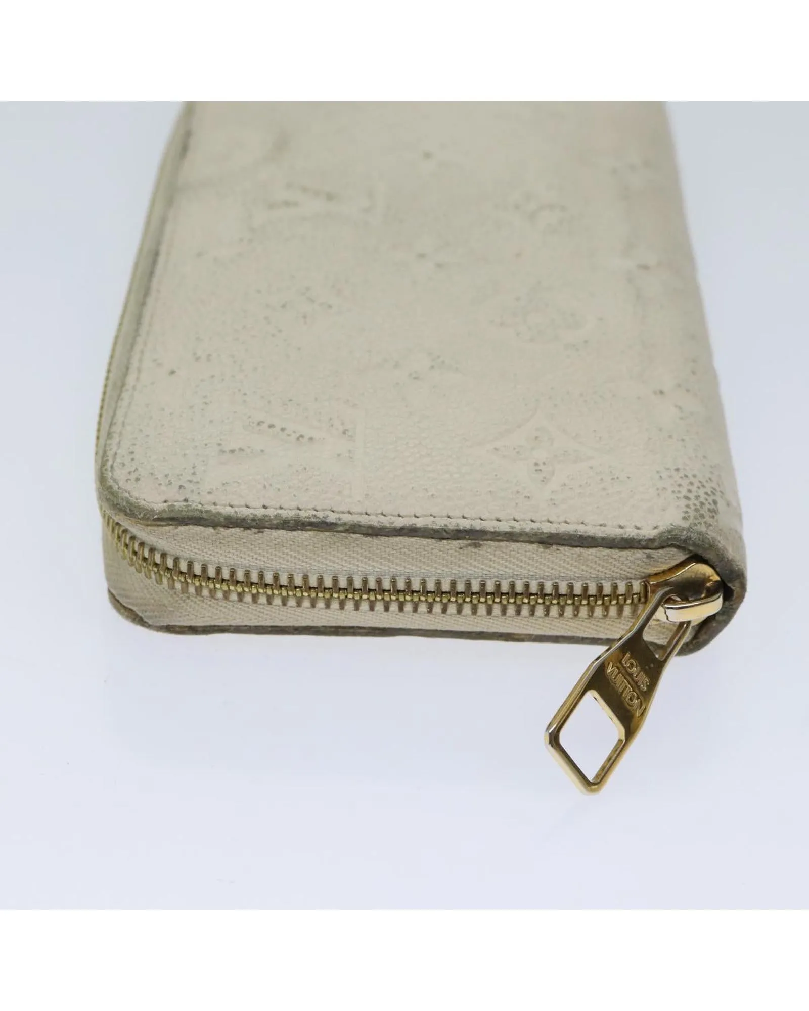 Embossed Leather Zippy Wallet with Multiple Pockets and Compartments