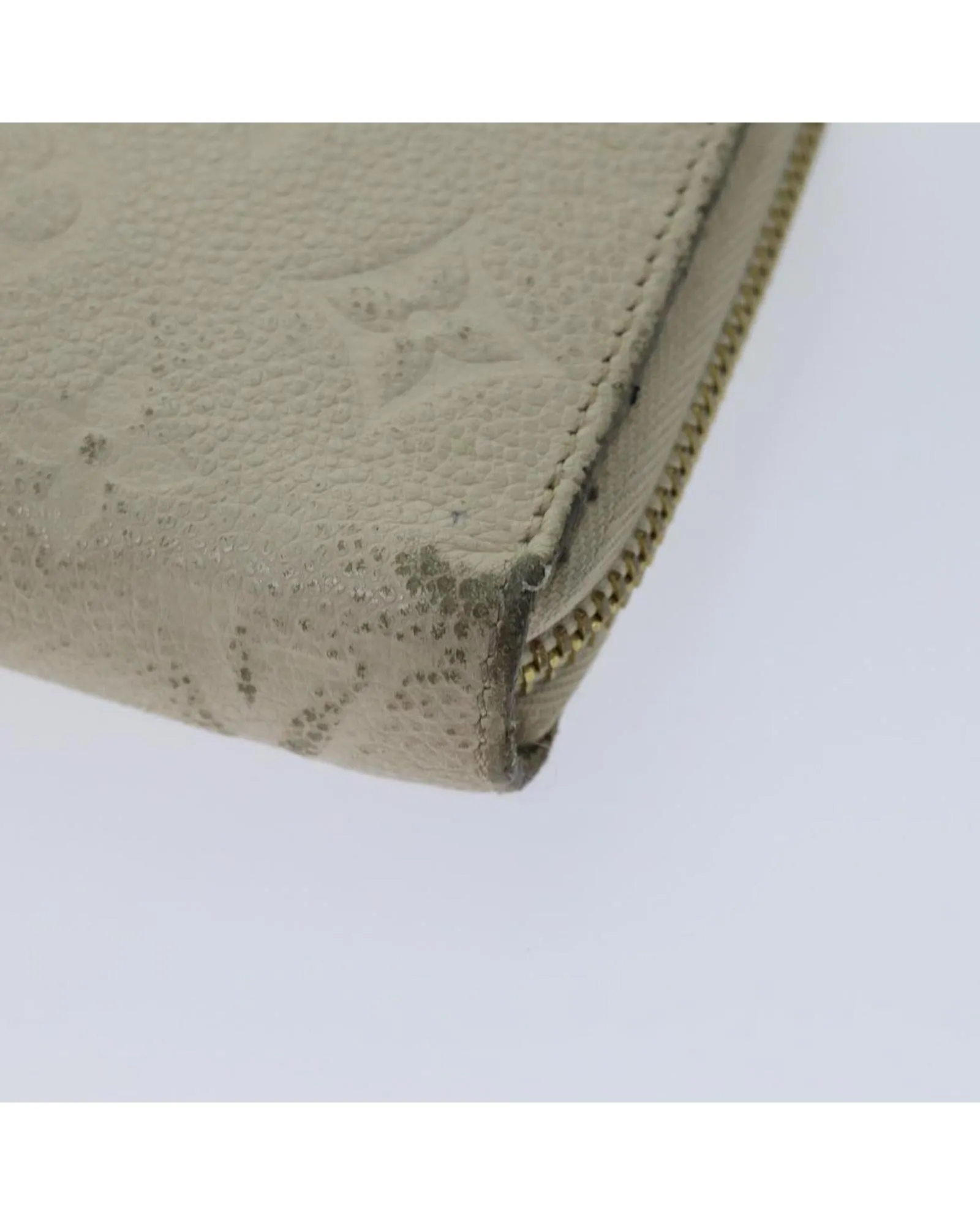 Embossed Leather Zippy Wallet with Multiple Pockets and Compartments