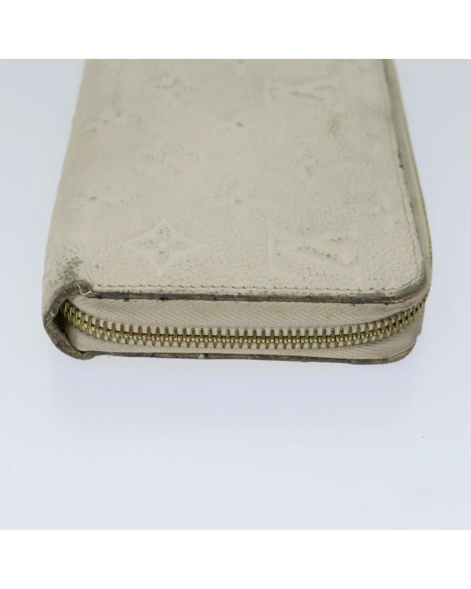 Embossed Leather Zippy Wallet with Multiple Pockets and Compartments